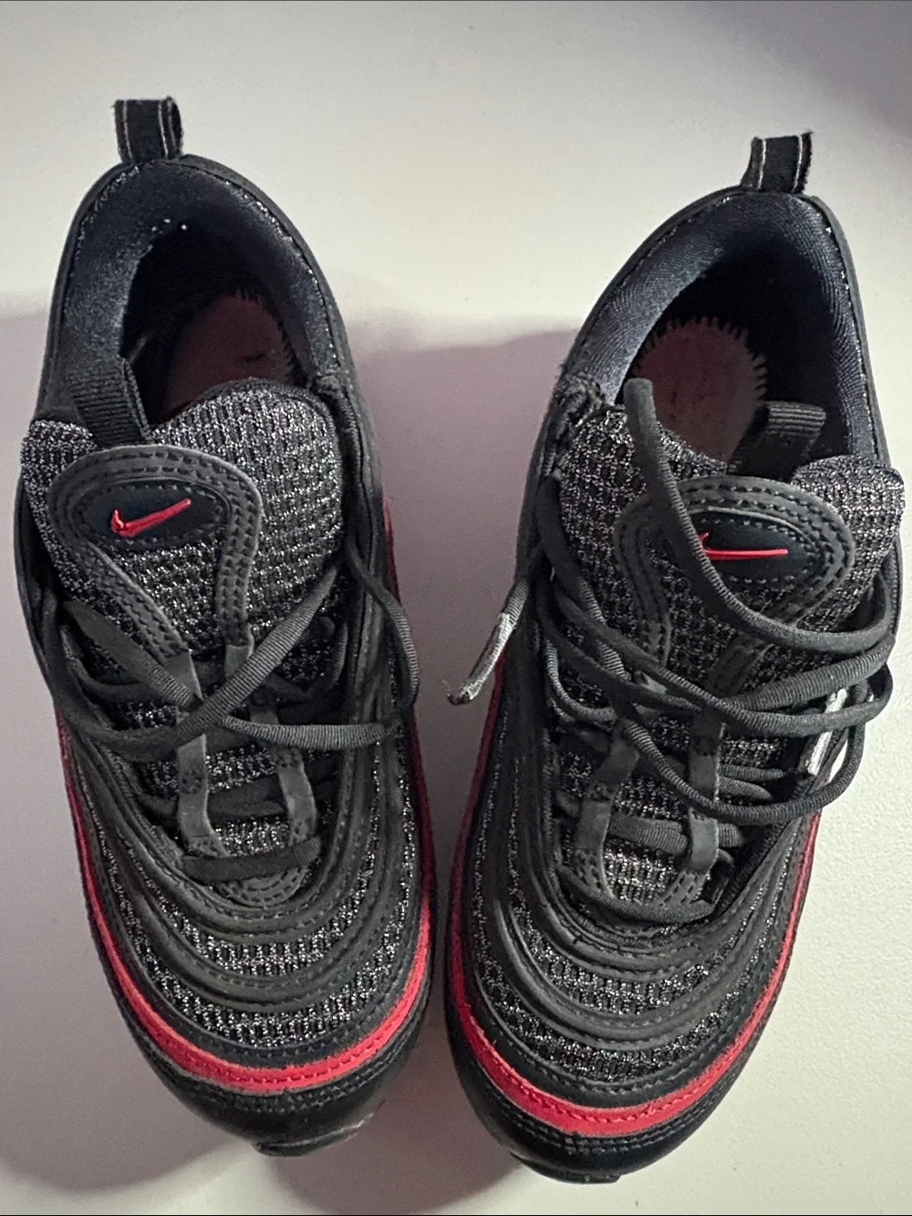 Unisex Nike AirMax (6) Black Sneakers with Red Trim.